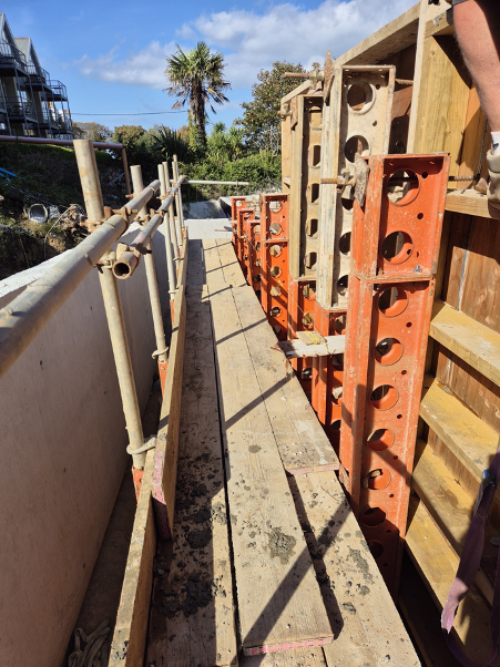 Intricate bespoke timber formwork for retaining wall