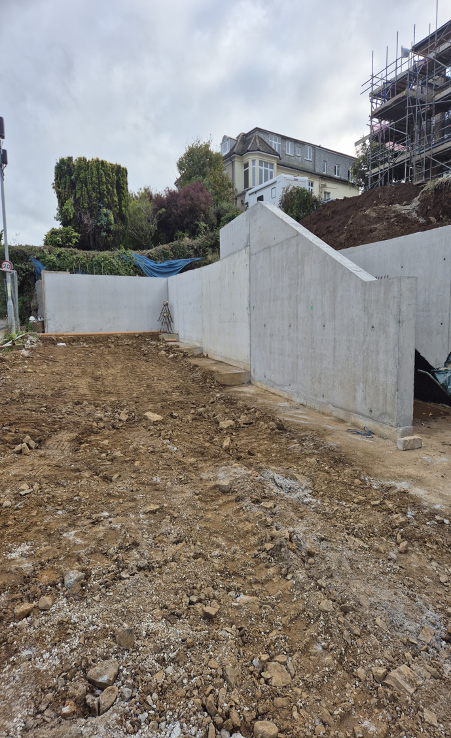 Large concrete retaining wall foundation